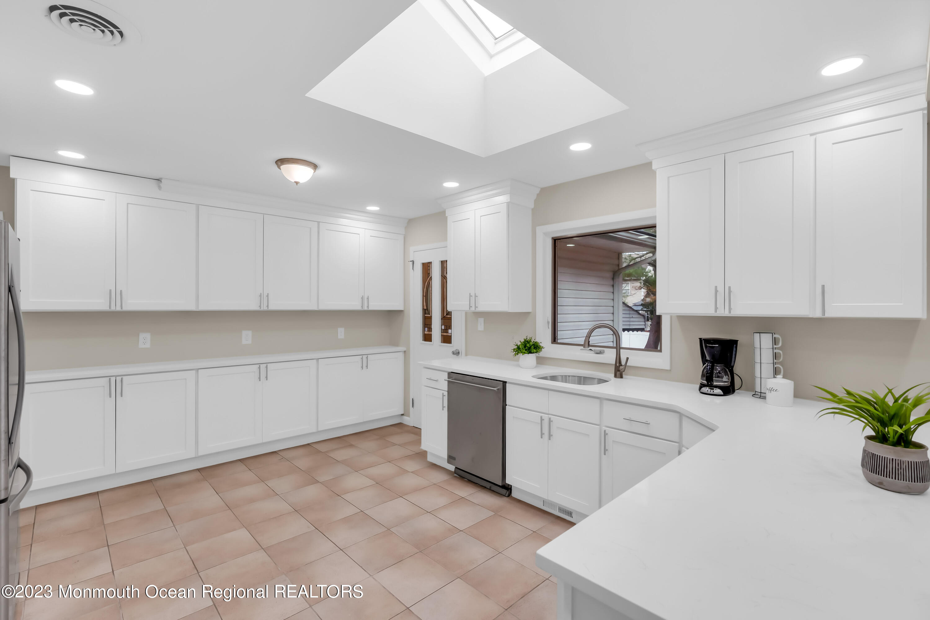 176 Bartley Road Jackson, NJ 08527 - Photo 29 of 51 a kitchen with a sink white cabinets and white appliances