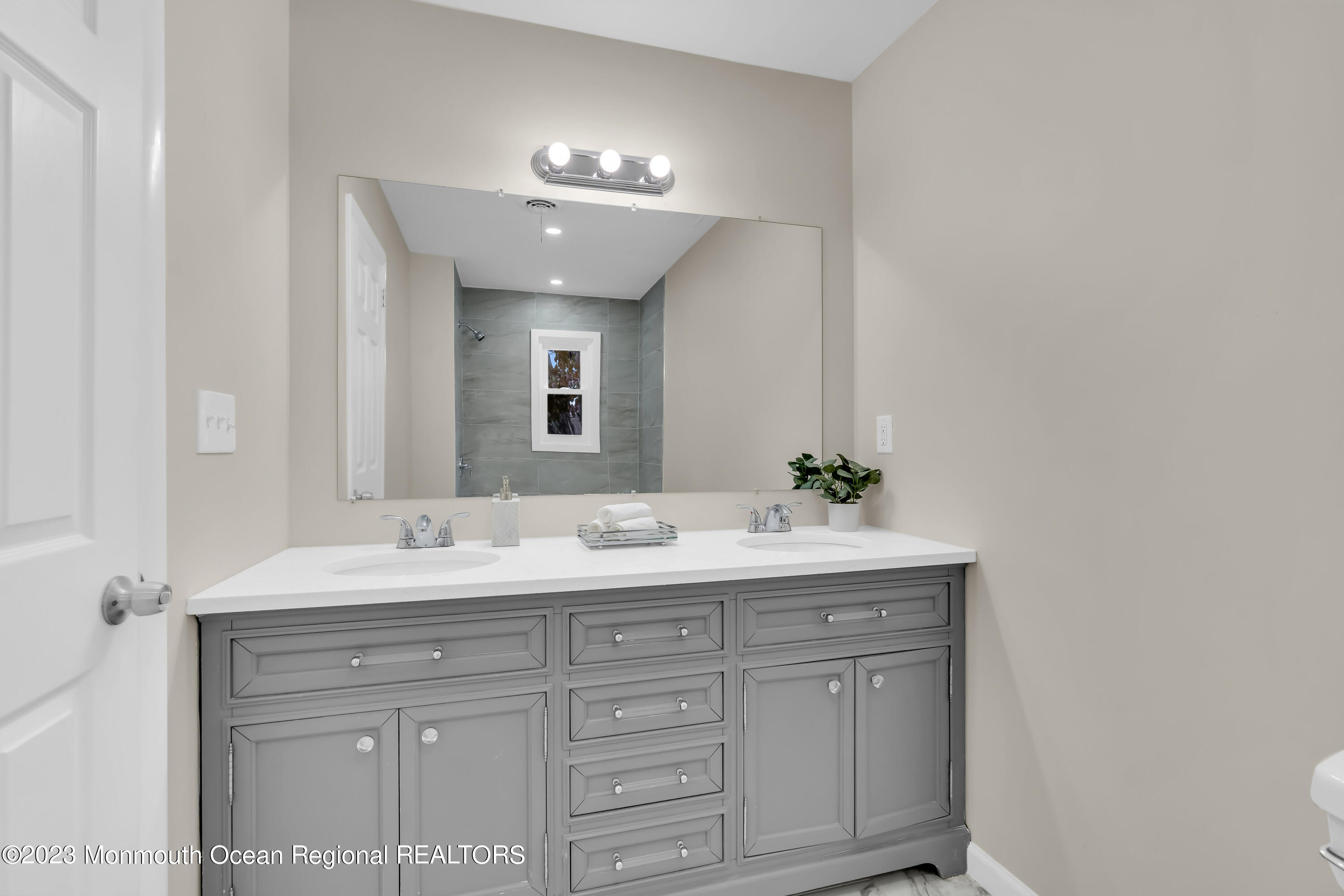176 Bartley Road Jackson, NJ 08527 - Photo 39 of 51 a bathroom with a sink and a mirror