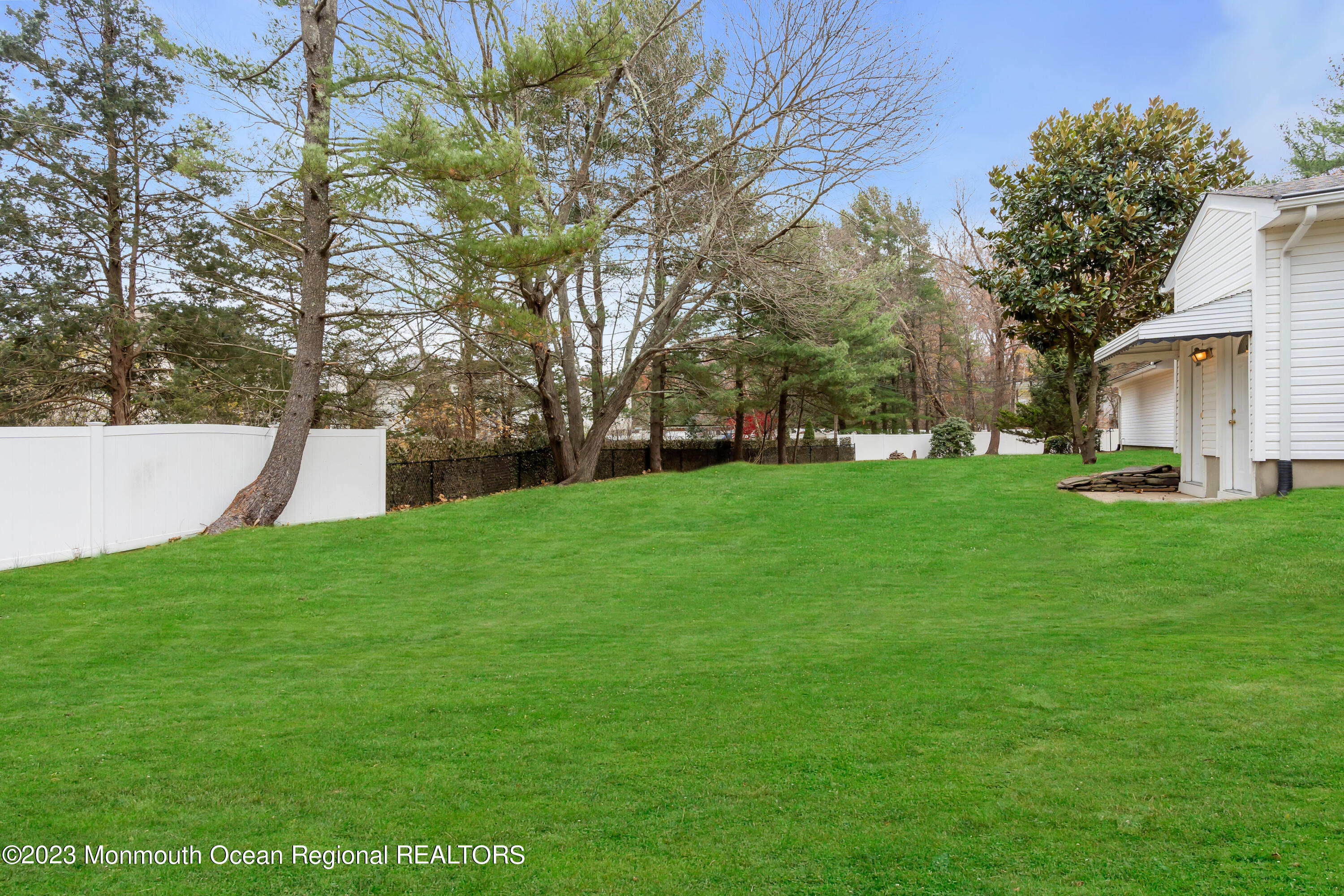 176 Bartley Road Jackson, NJ 08527 - Photo 7 of 51 a view of a backyard with large trees