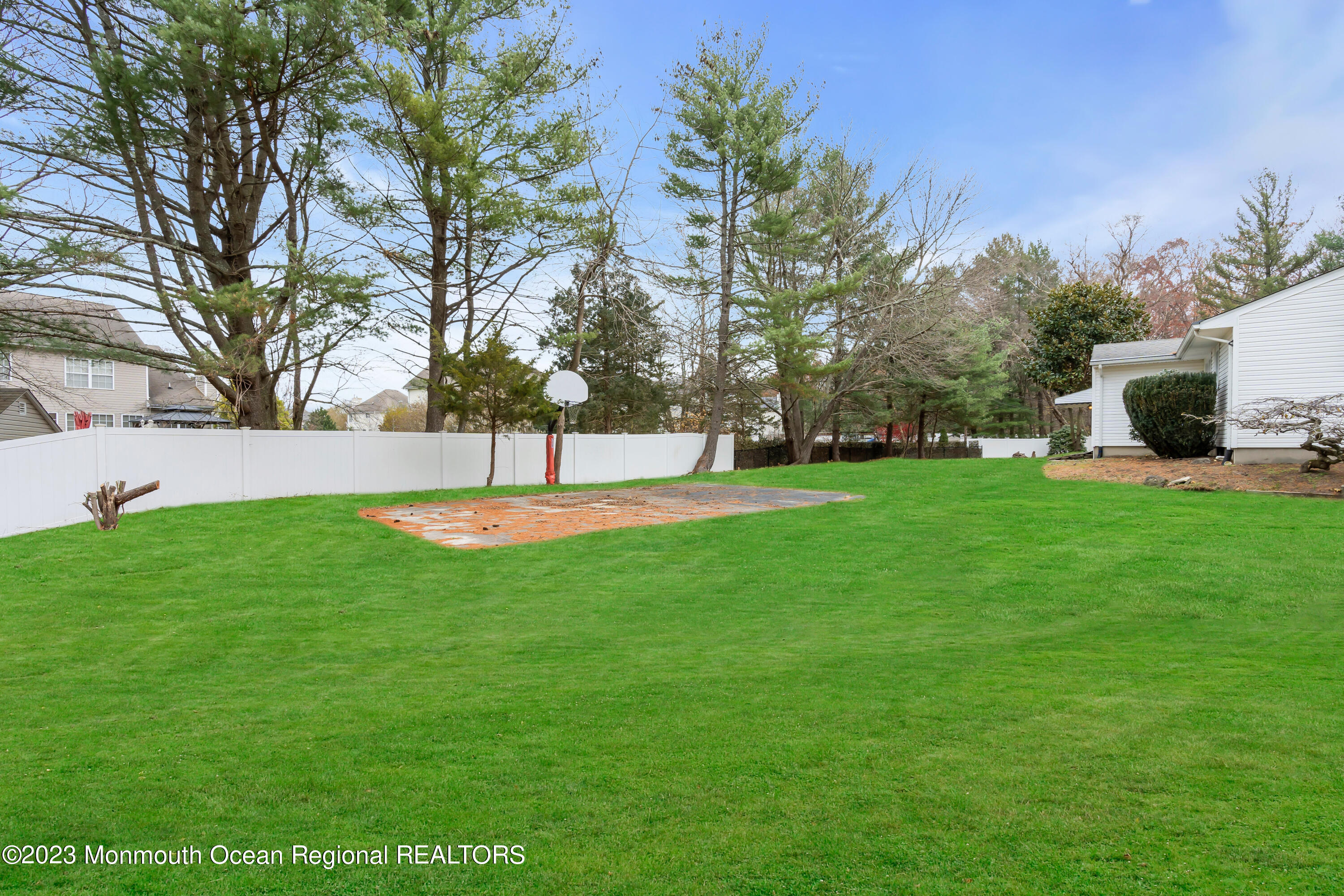 176 Bartley Road Jackson, NJ 08527 - Photo 8 of 51 a view of a garden with a building in the background