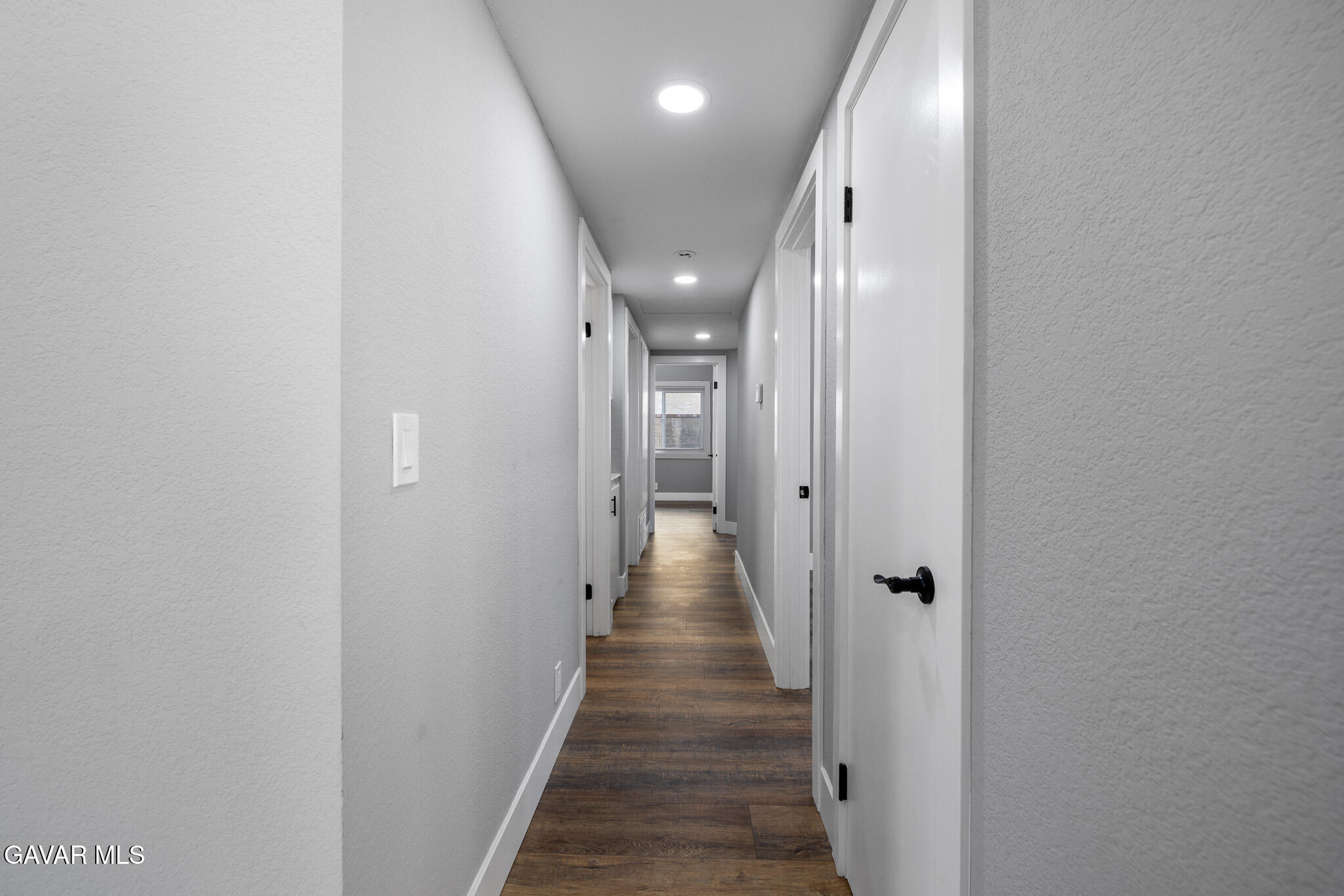 4753 East Ave R 11 Palmdale, CA 93552 - Photo 15 of 41 a view of a hallway with wooden floor