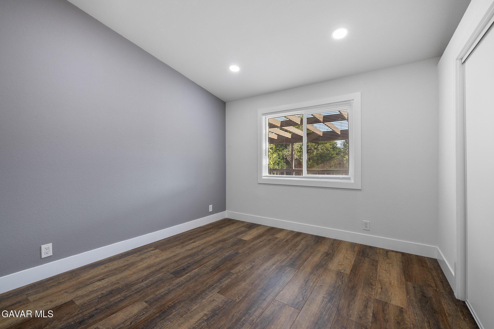 4753 East Ave R 11 Palmdale, CA 93552 - Photo 16 of 41 wooden floor in an empty room with a window