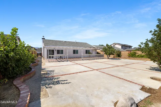a house with palm tree in front of it