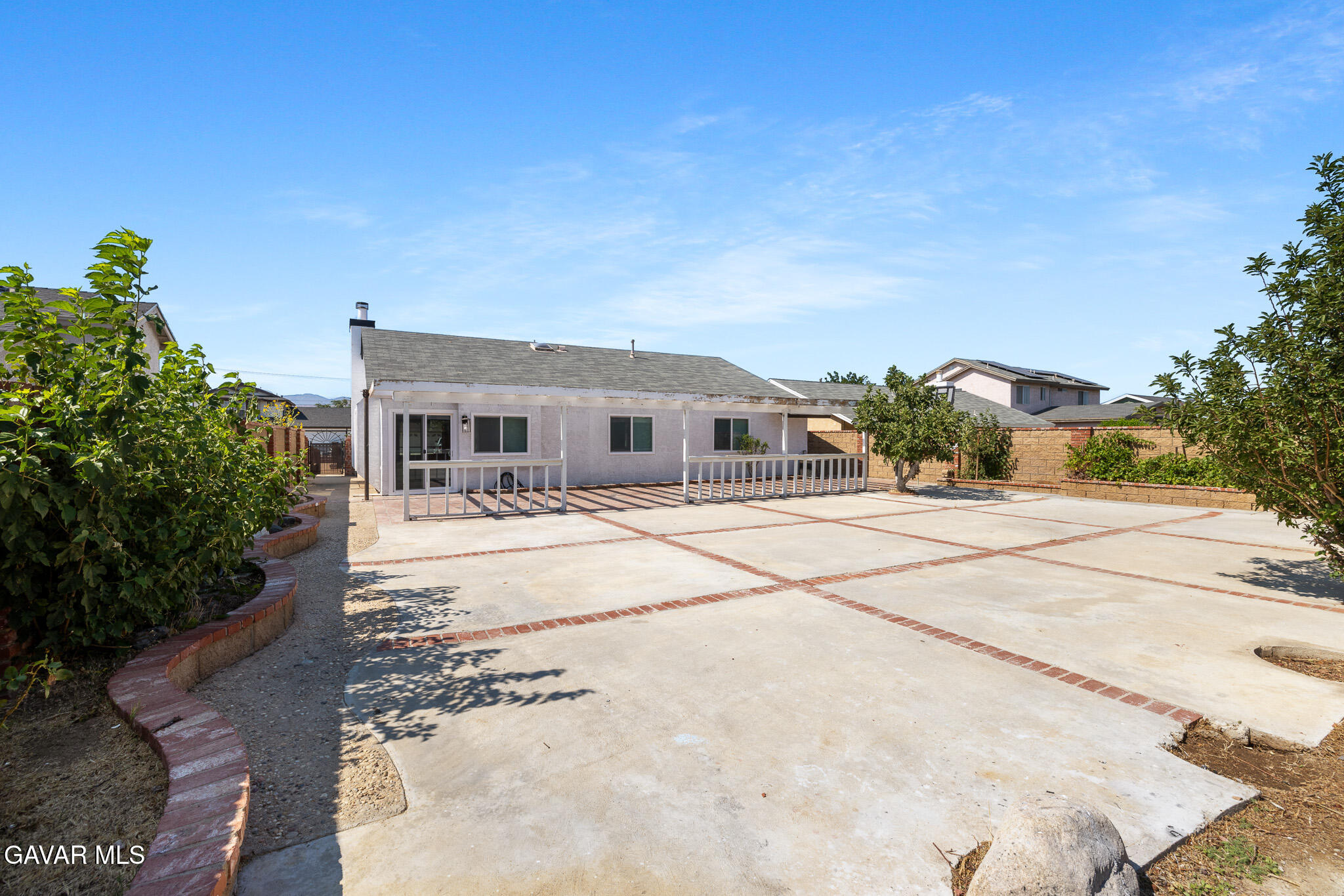 4753 East Ave R 11 Palmdale, CA 93552 - Photo 34 of 41 a house with palm tree in front of it