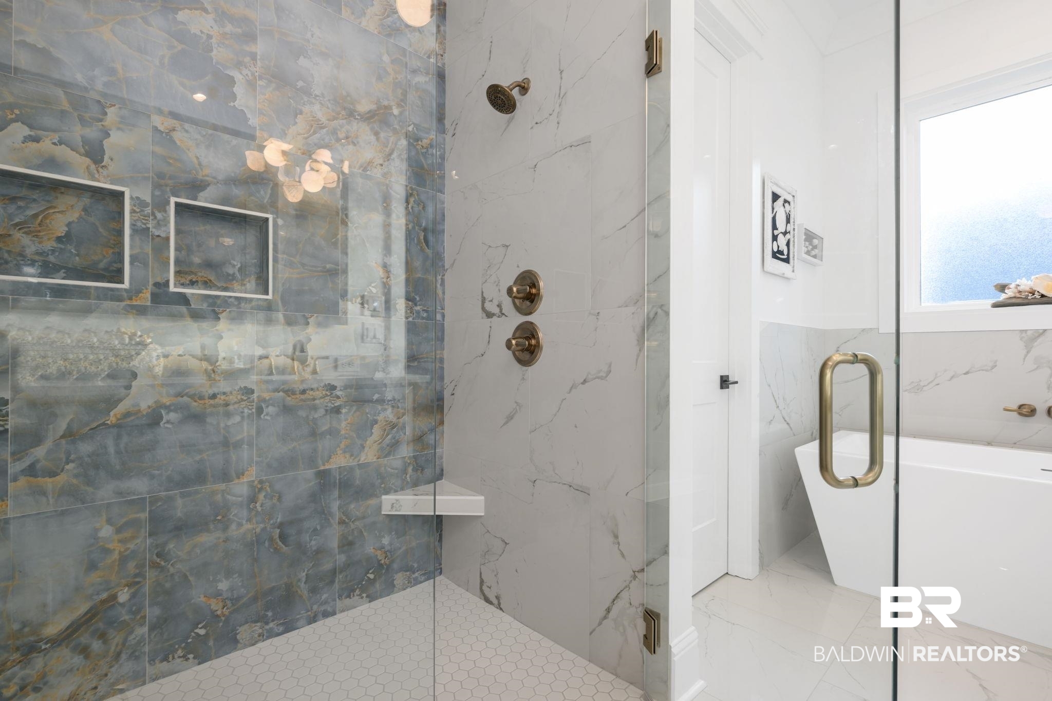 30313 River Road Orange Beach, AL 36561 - Photo 24 of 50 Bathroom with a freestanding bath, a marble finish shower, and marble tiled flooring