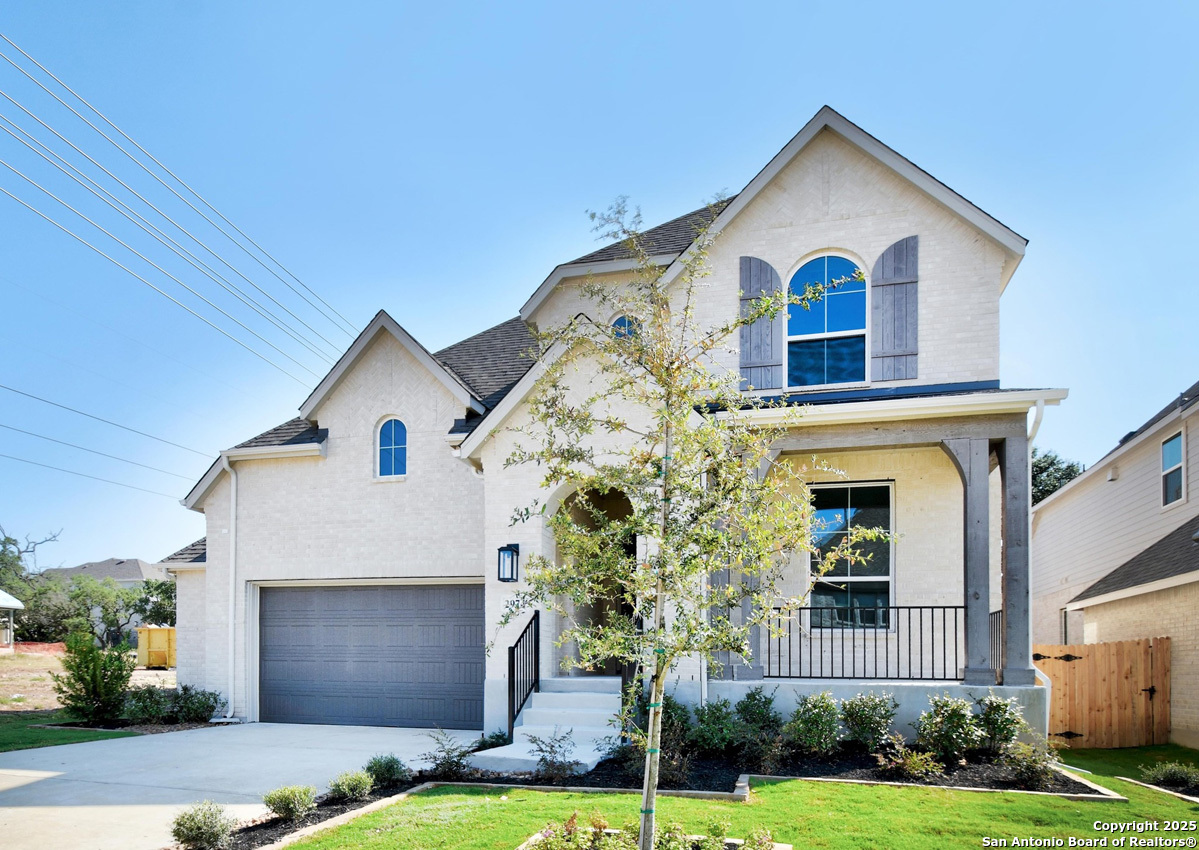 a view of house with yard and garden