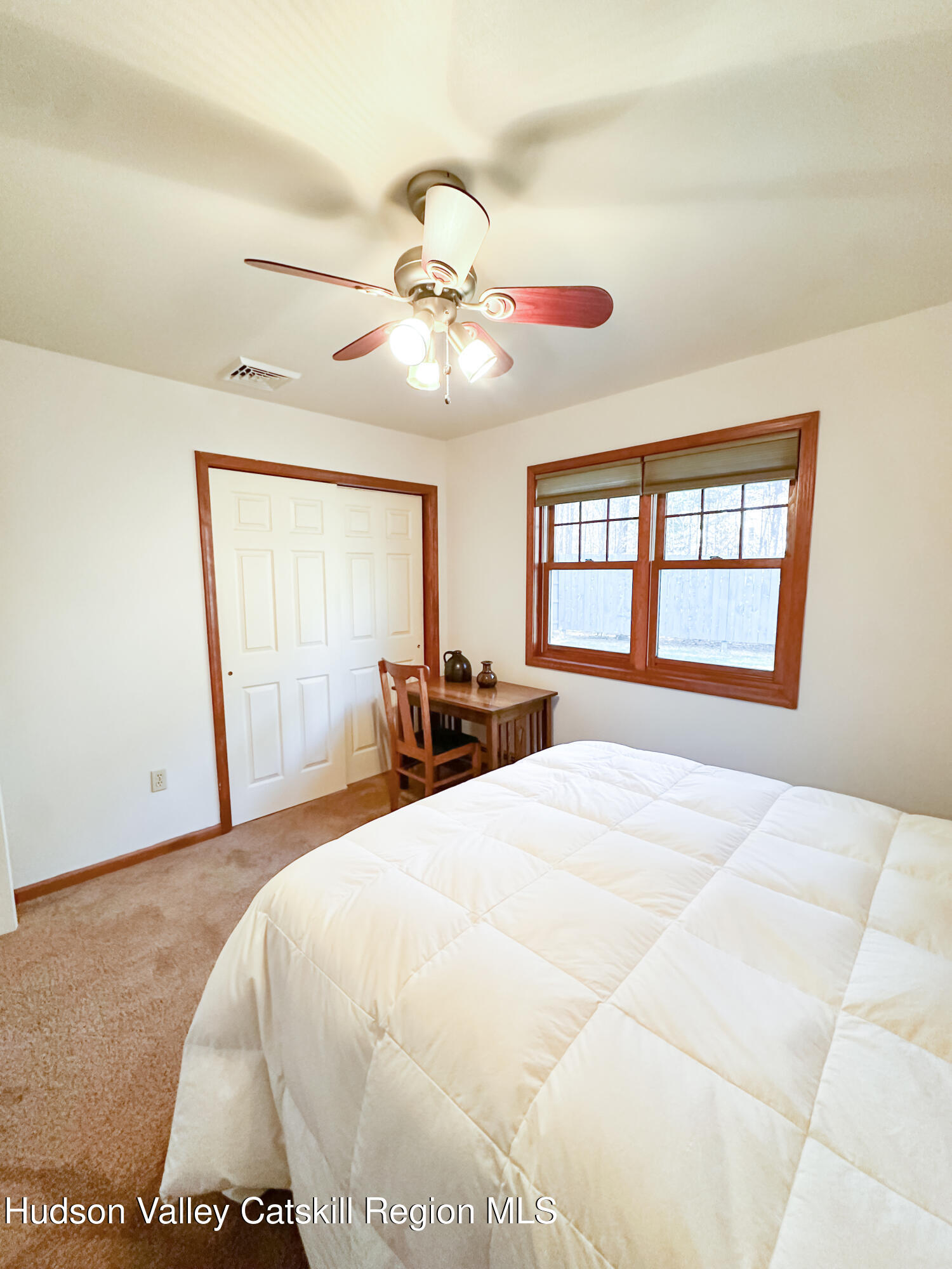 596 Joseph Chadderdon Road Acra, NY 12405 - Photo 15 of 55 a bedroom with a large bed and a chandelier