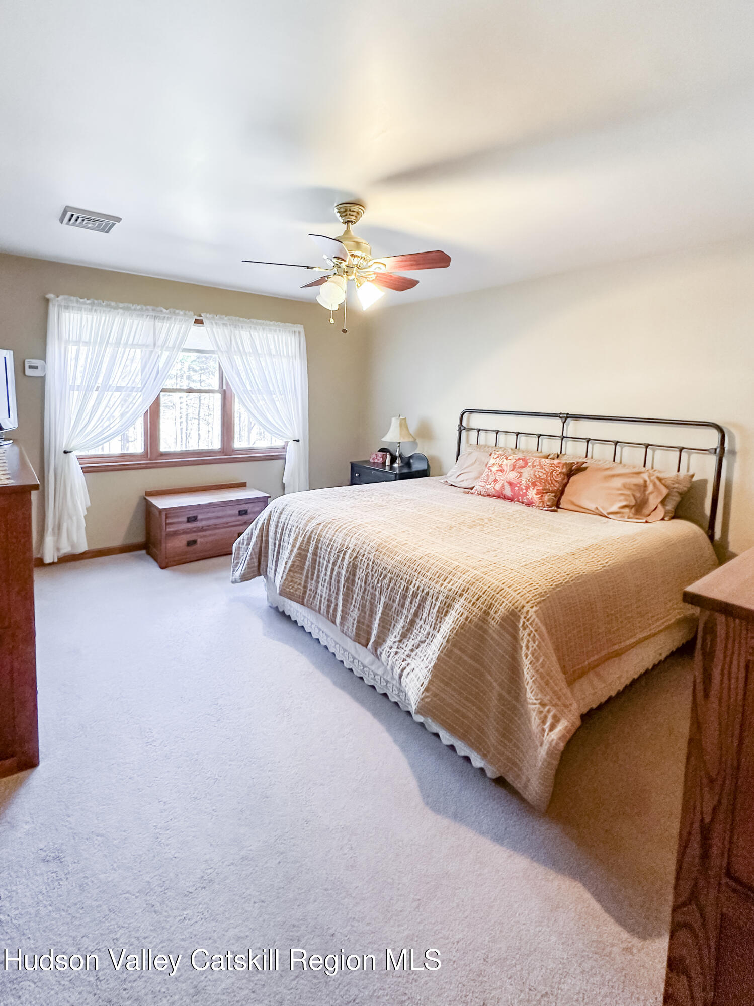 596 Joseph Chadderdon Road Acra, NY 12405 - Photo 16 of 55 a bedroom with a bed and a chandelier