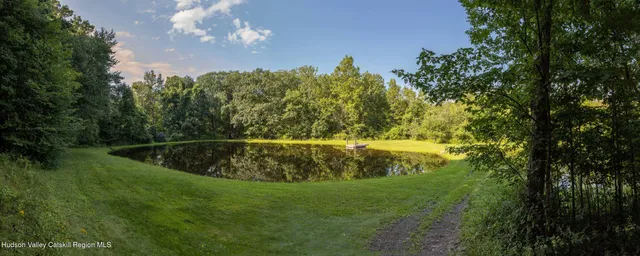 a view of a lake with a yard