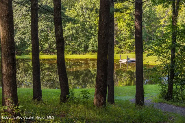 a view of a swimming pool with an outdoor space and seating area