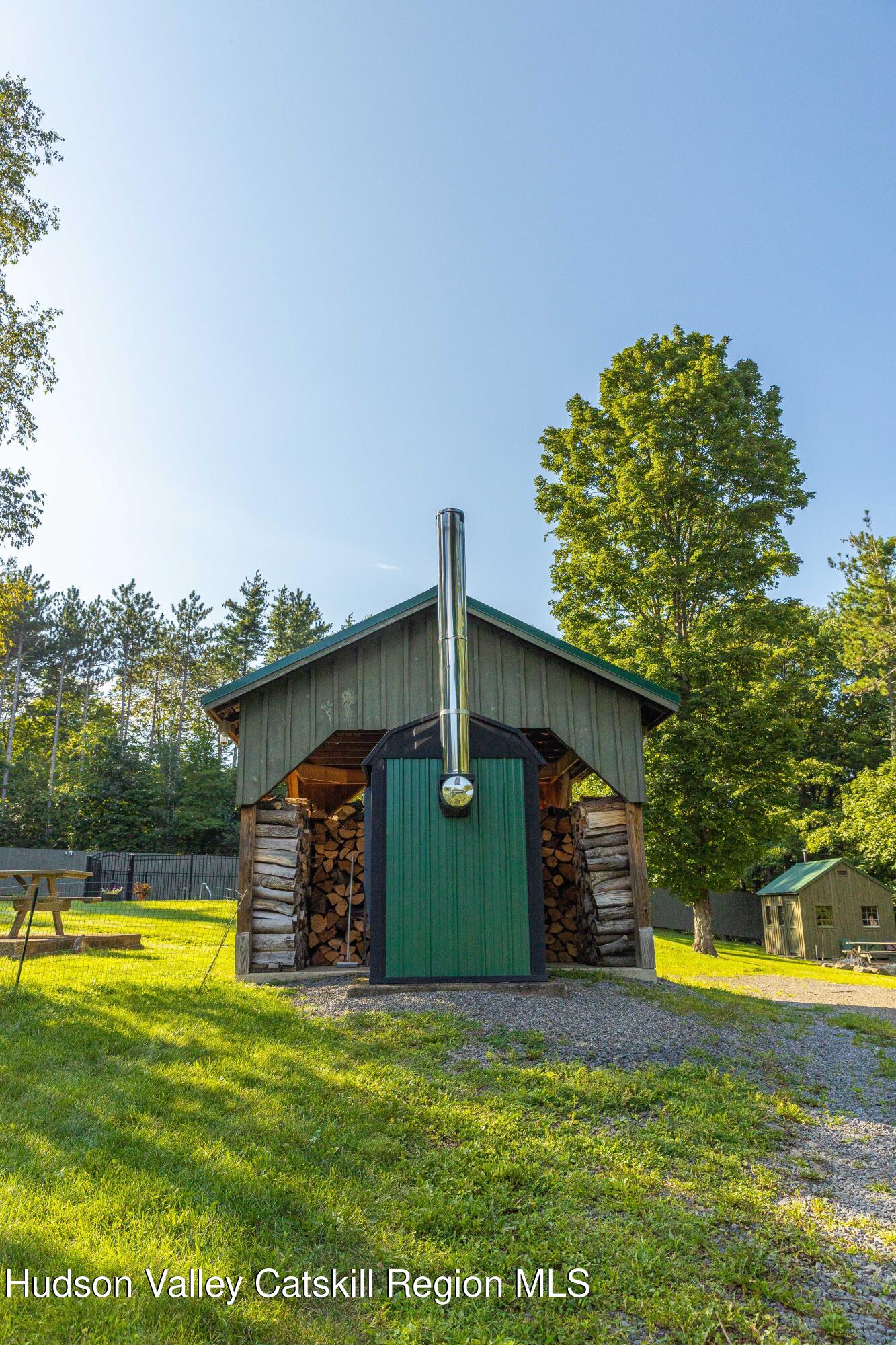 596 Joseph Chadderdon Road Acra, NY 12405 - Photo 44 of 55 a view of a swimming pool with an outdoor space and seating area