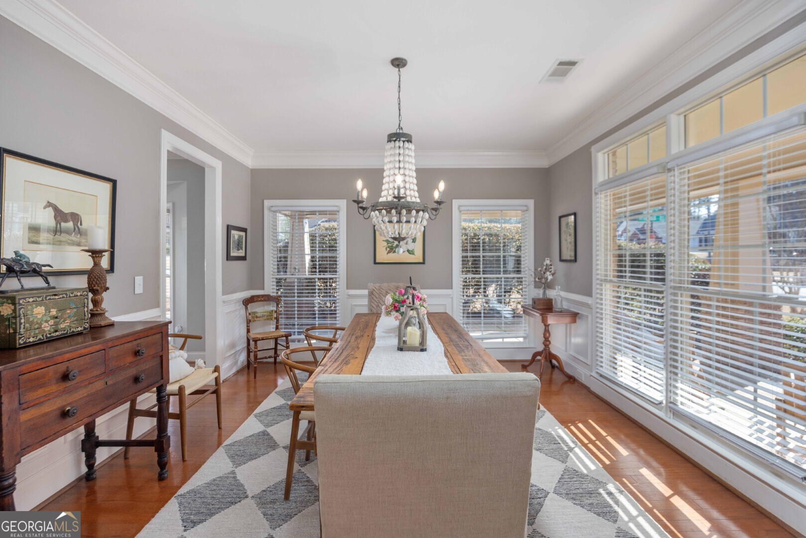 6742 Bridge Way Columbus, GA 31904 - Photo 11 of 45 a living room with furniture and a chandelier