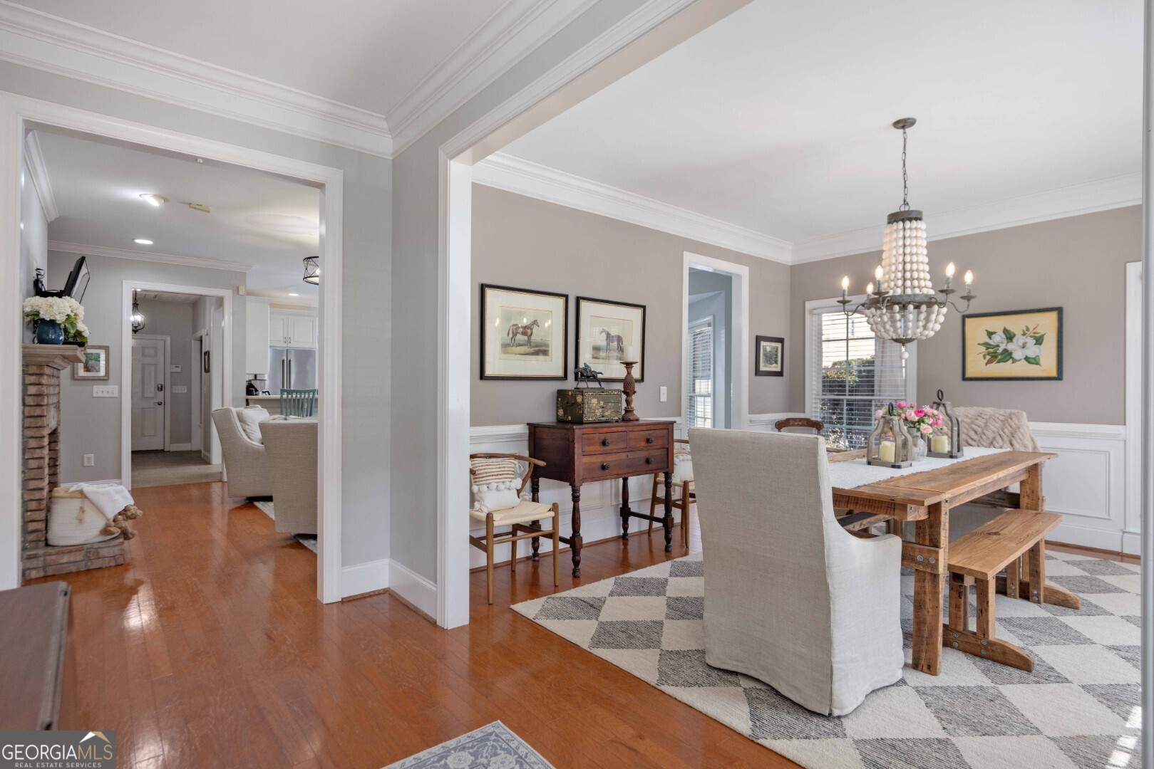 6742 Bridge Way Columbus, GA 31904 - Photo 13 of 45 a view of a dining room and livingroom with furniture wooden floor a chandelier