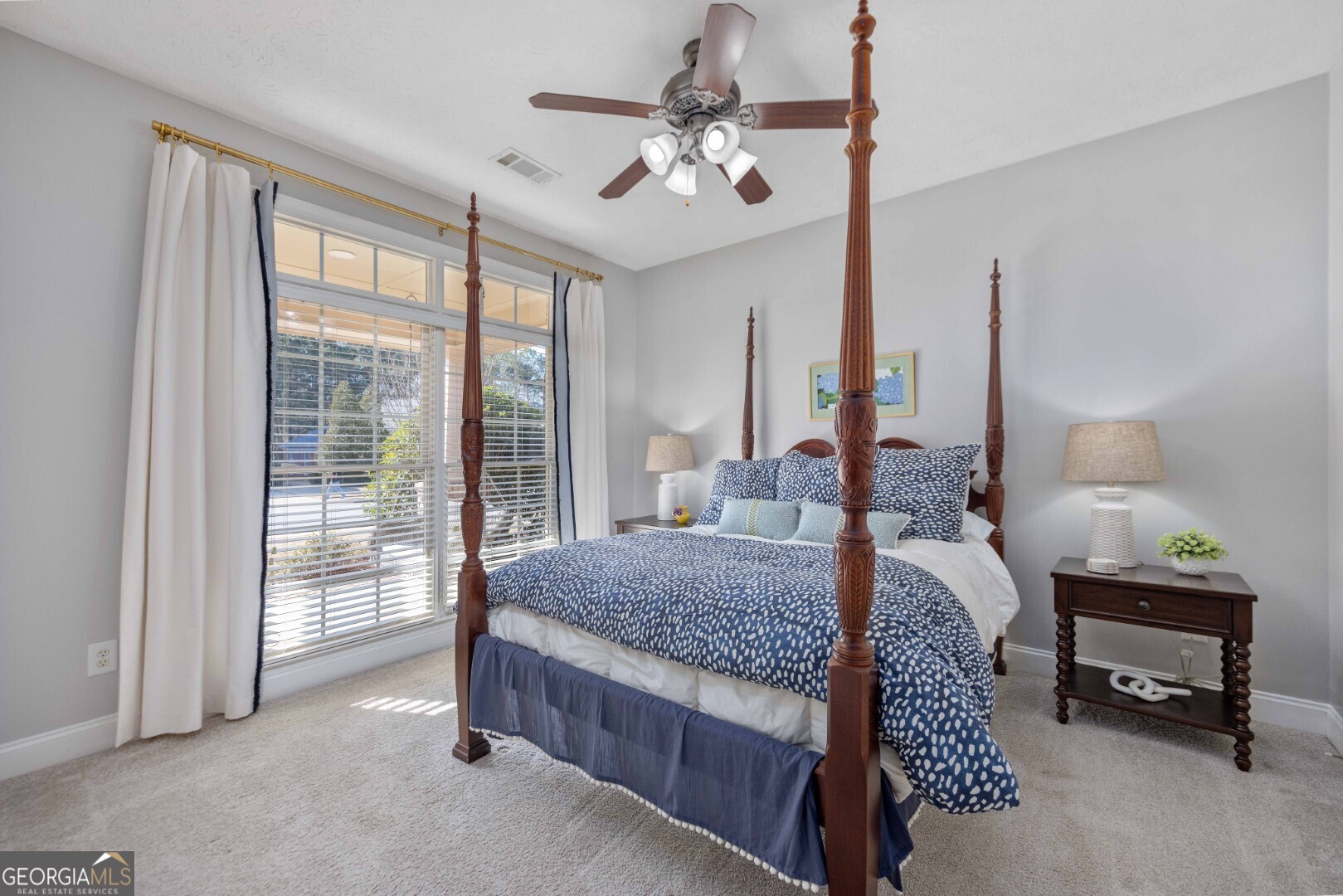 6742 Bridge Way Columbus, GA 31904 - Photo 14 of 45 a bed room with a bed and a chandelier