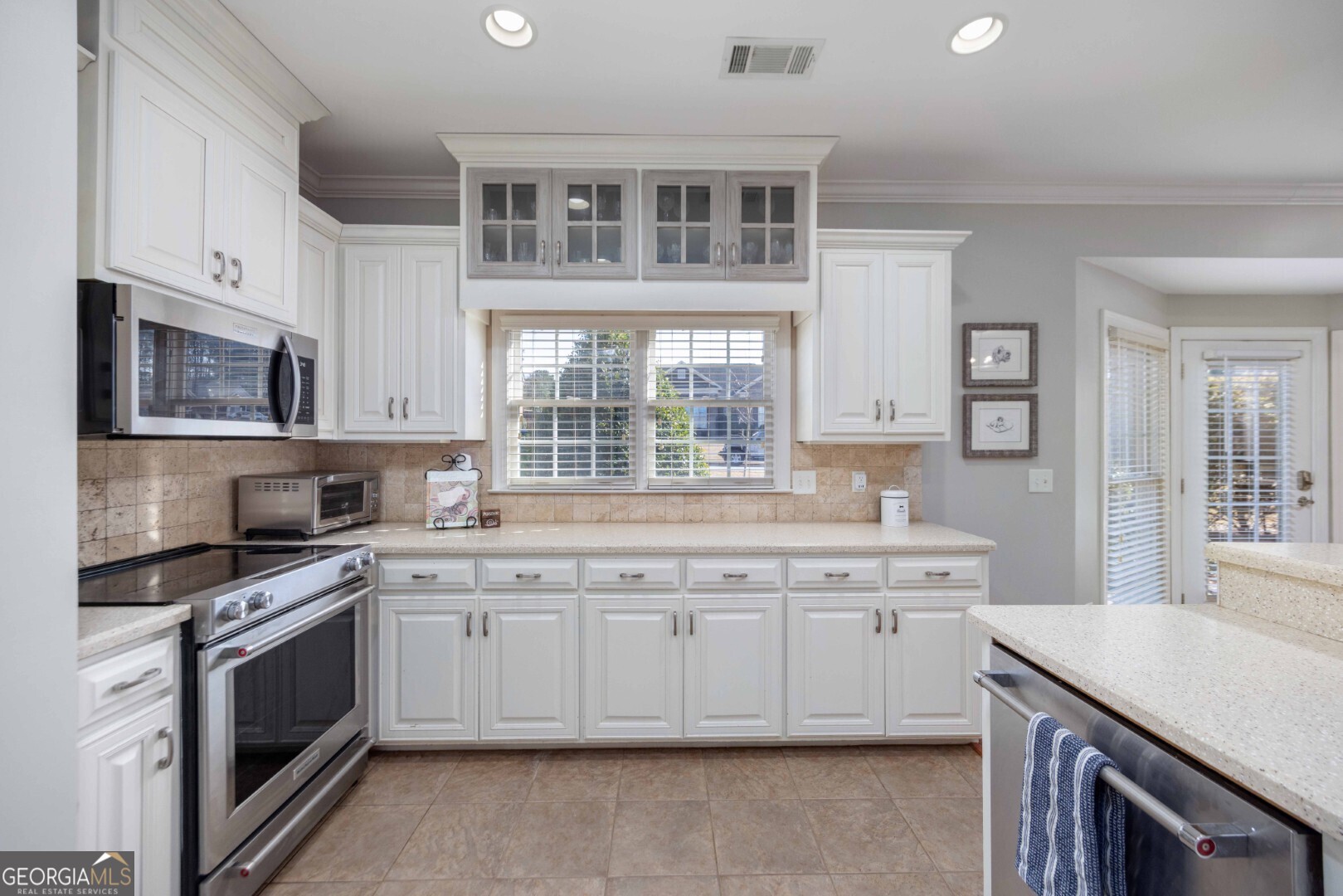 6742 Bridge Way Columbus, GA 31904 - Photo 21 of 45 a kitchen with stainless steel appliances granite countertop a stove and a sink