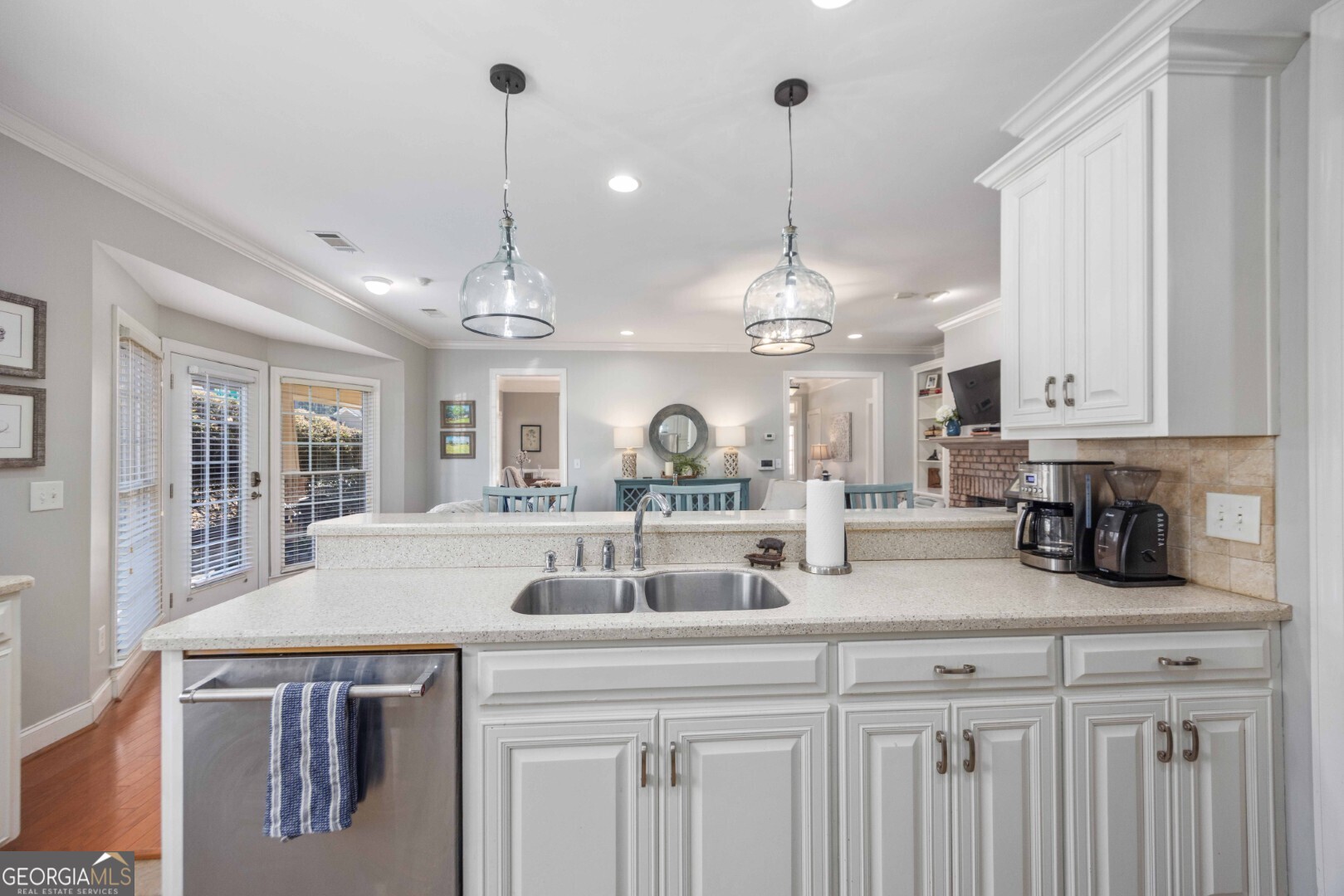 6742 Bridge Way Columbus, GA 31904 - Photo 22 of 45 a view of a center island and chandelier