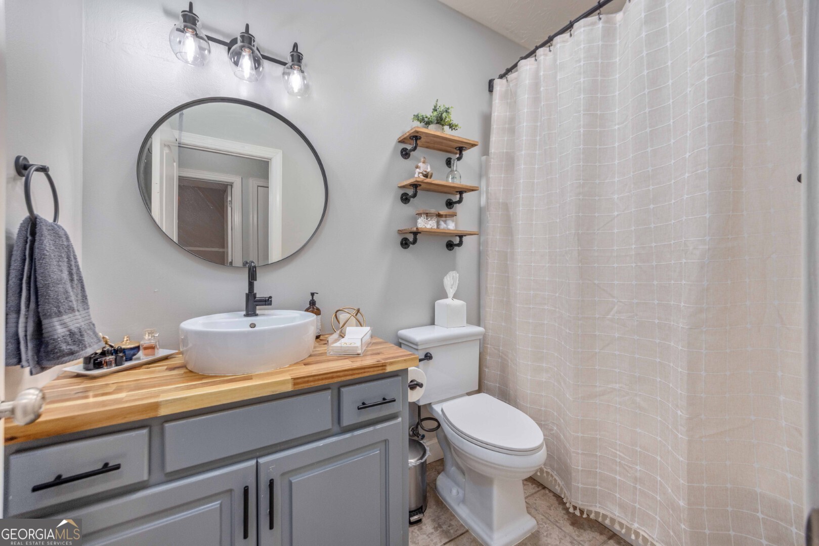 6742 Bridge Way Columbus, GA 31904 - Photo 26 of 45 a bathroom with a toilet sink and mirror