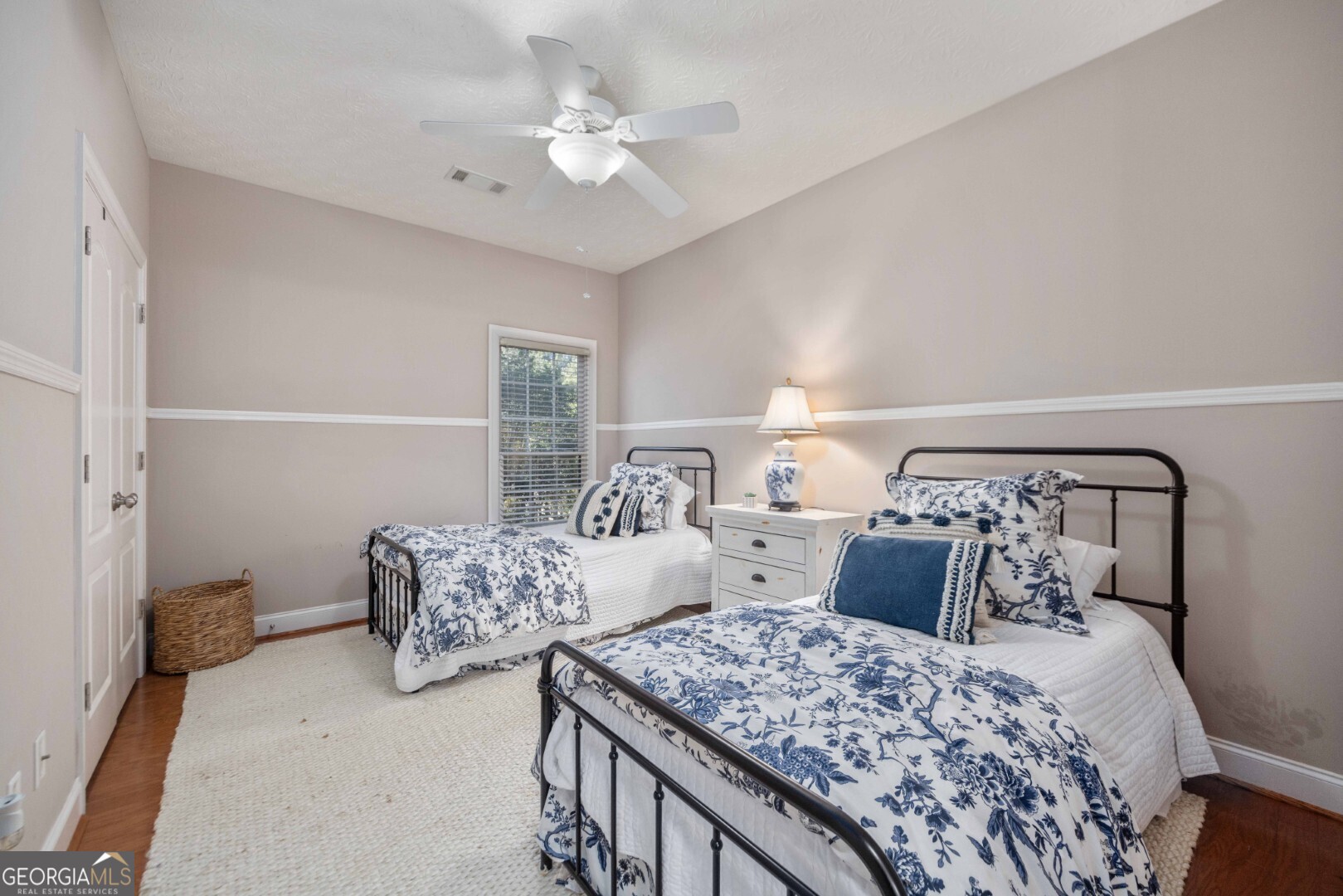 6742 Bridge Way Columbus, GA 31904 - Photo 28 of 45 a bedroom with two beds and a chandelier