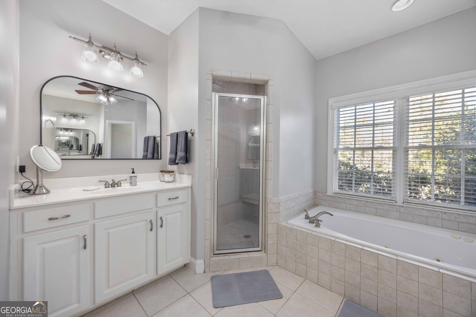 6742 Bridge Way Columbus, GA 31904 - Photo 32 of 45 a spacious bathroom with a double vanity sink mirror and bathtub