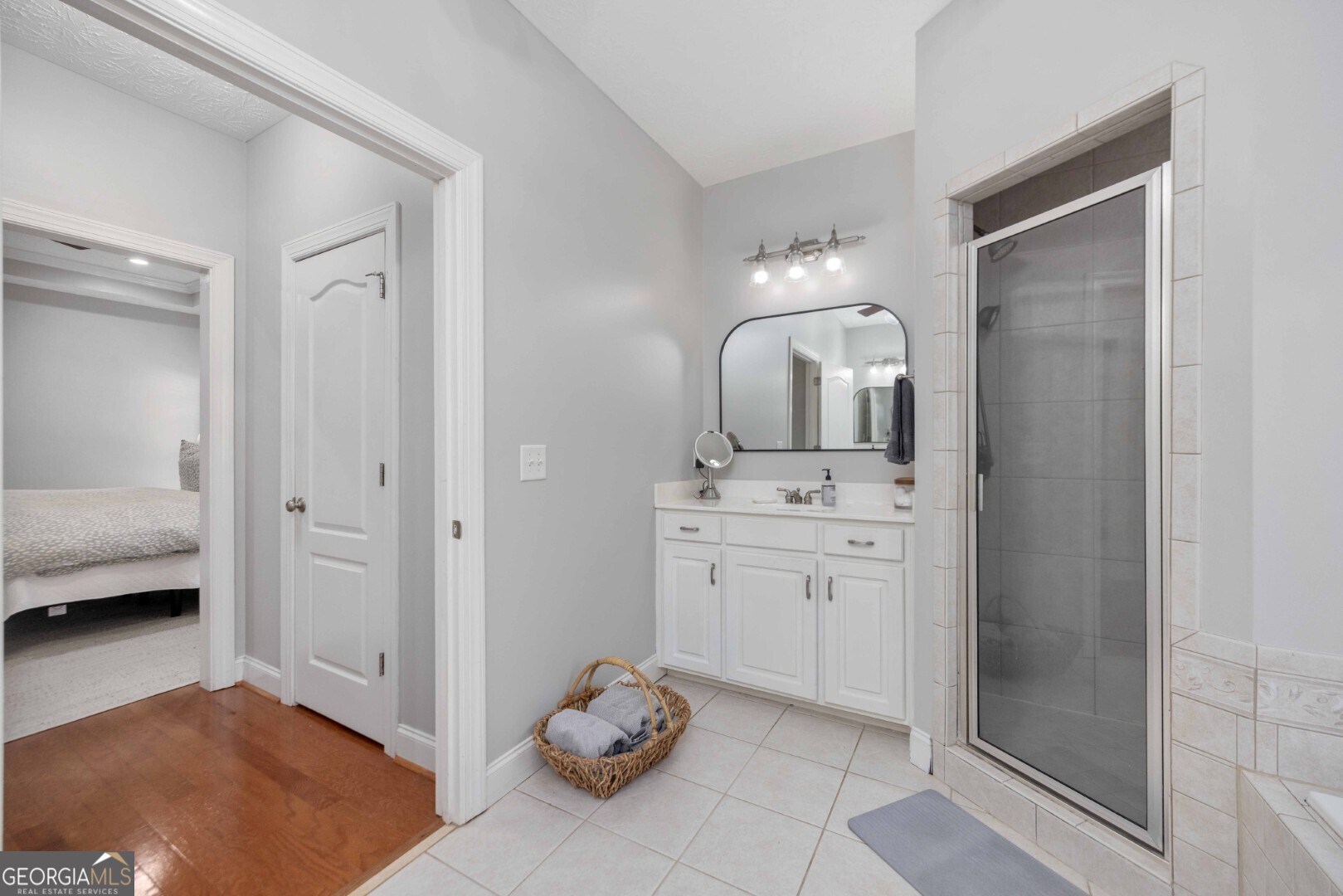 6742 Bridge Way Columbus, GA 31904 - Photo 33 of 45 a spacious bathroom with a double vanity sink and a mirror