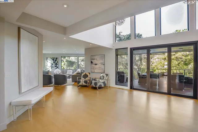 a view of a livingroom with furniture water view and a large window