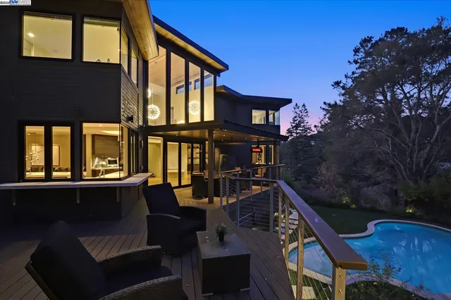 a view of a house with yard and sitting area