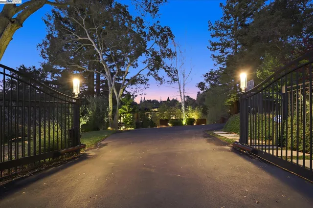 a outdoor sitting area with a bench and wooden floor