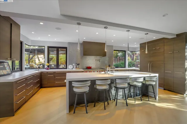 a kitchen with a table and chairs in it