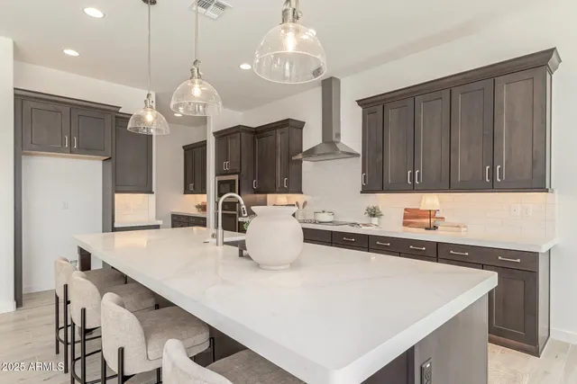 a kitchen with sink cabinets and refrigerator