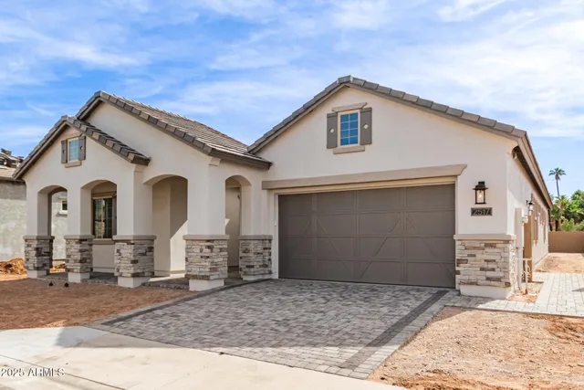a view of a white house with a outdoor space