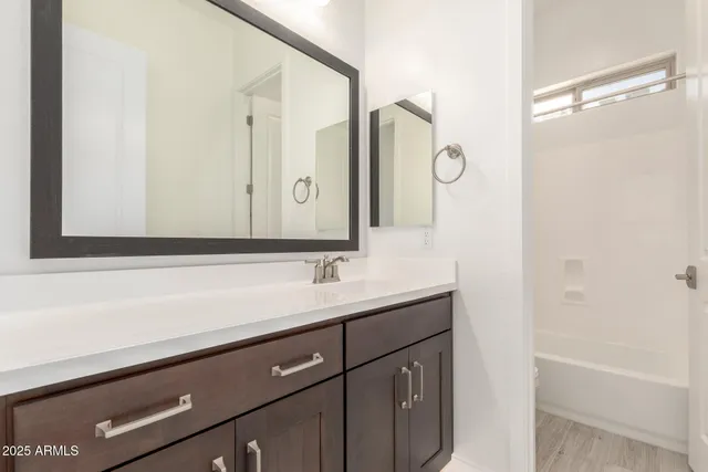 a bathroom with a bathtub and a toilet