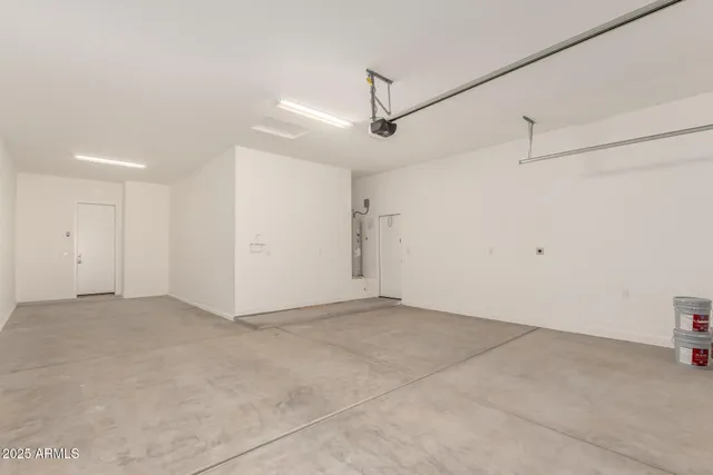 a view of a house with a wooden fence