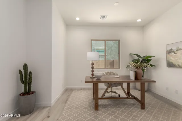 a workspace with furniture and window