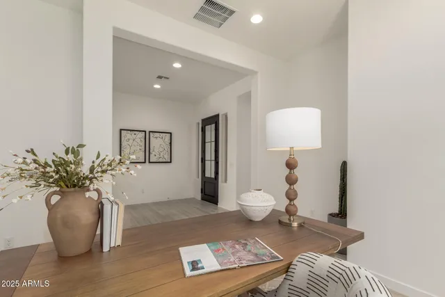a living room with furniture and a potted plant