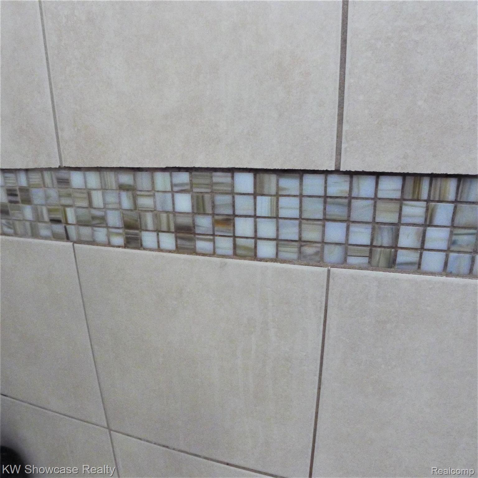 519 Byron Road Howell, MI 48843 - Photo 17 of 38 Custom Tile Inlays in tub area.