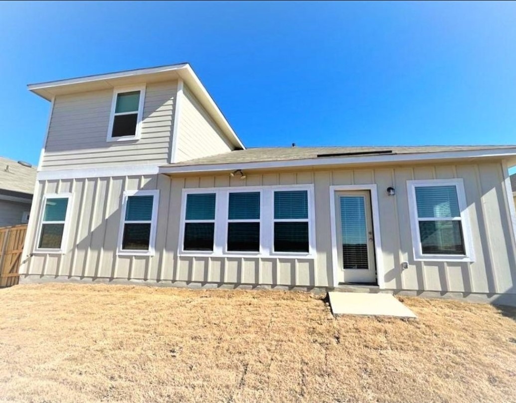 2771 Winding Creek Road Kyle, TX 78640 - Photo 18 of 24 A well-maintained facade with vertical siding and multiple windows offers a bright, inviting presence.