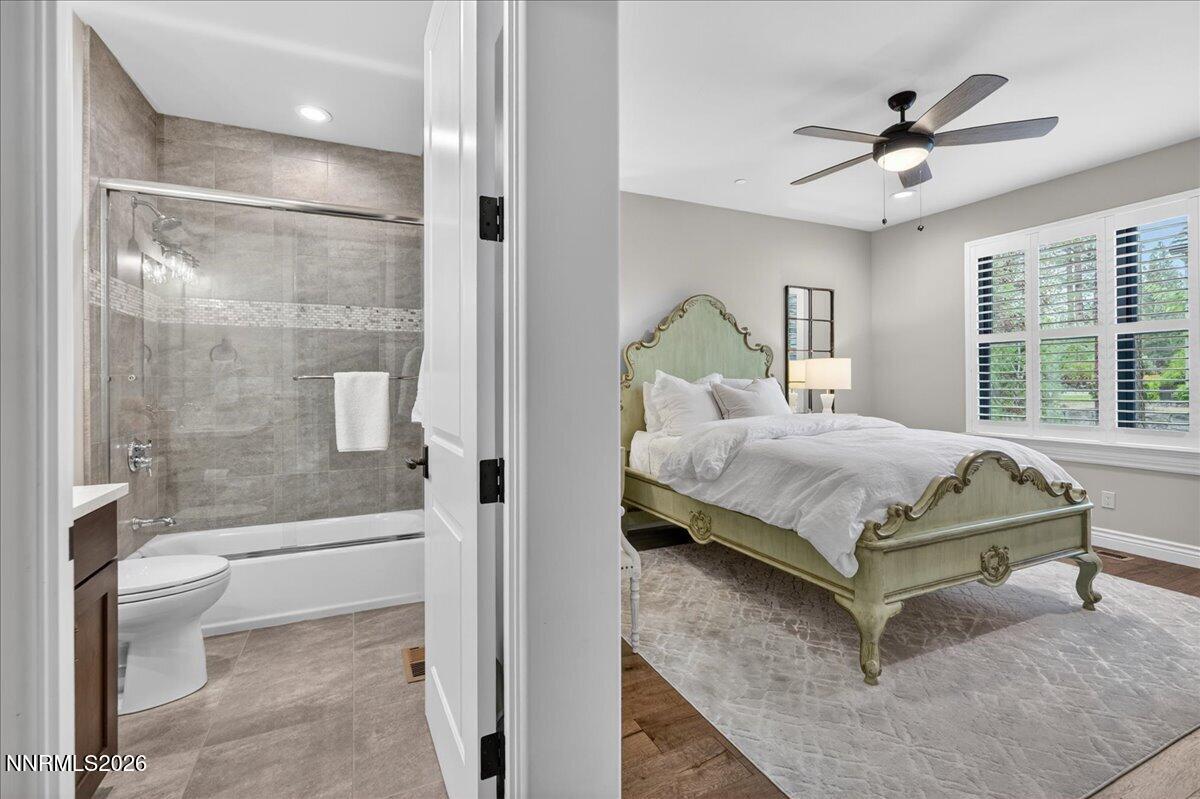 5096 Bordeaux Court Reno, NV 89511 - Photo 44 of 70 a bedroom with a bed and a glass door shower