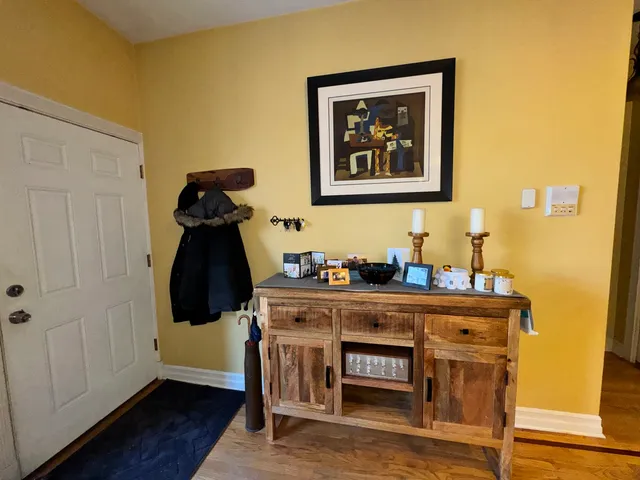 a room with a table and a mirror