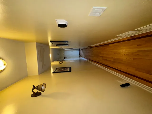 a room with a pool table and a chair