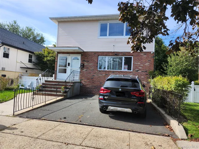 a car parked in front of a house