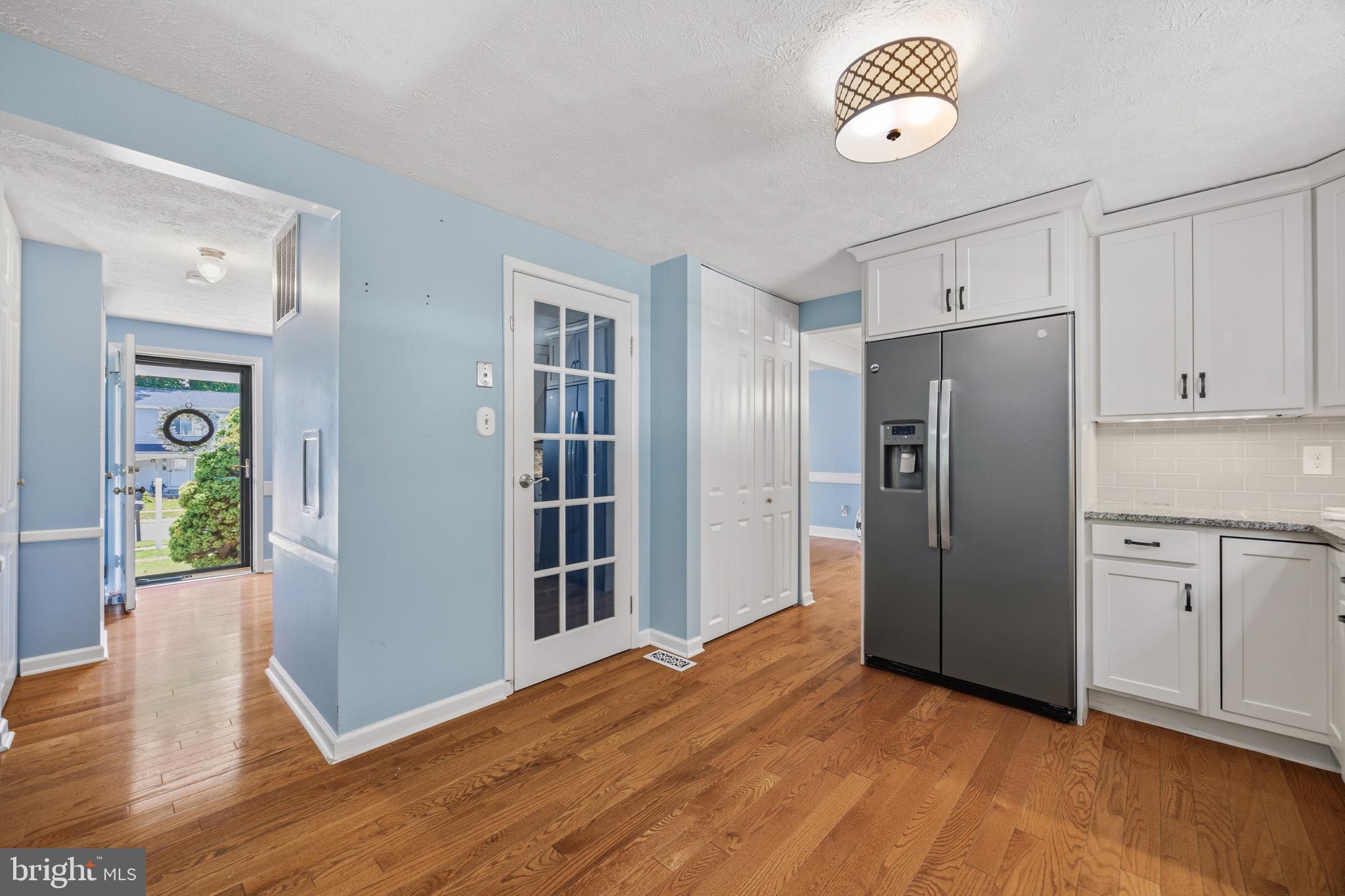 1506 Gollum Road Hanover, MD 21076 - Photo 15 of 44 a view of a kitchen with refrigerator and wooden floor