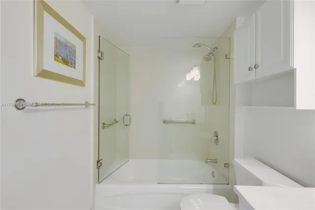 a bathroom with a bathtub and shower