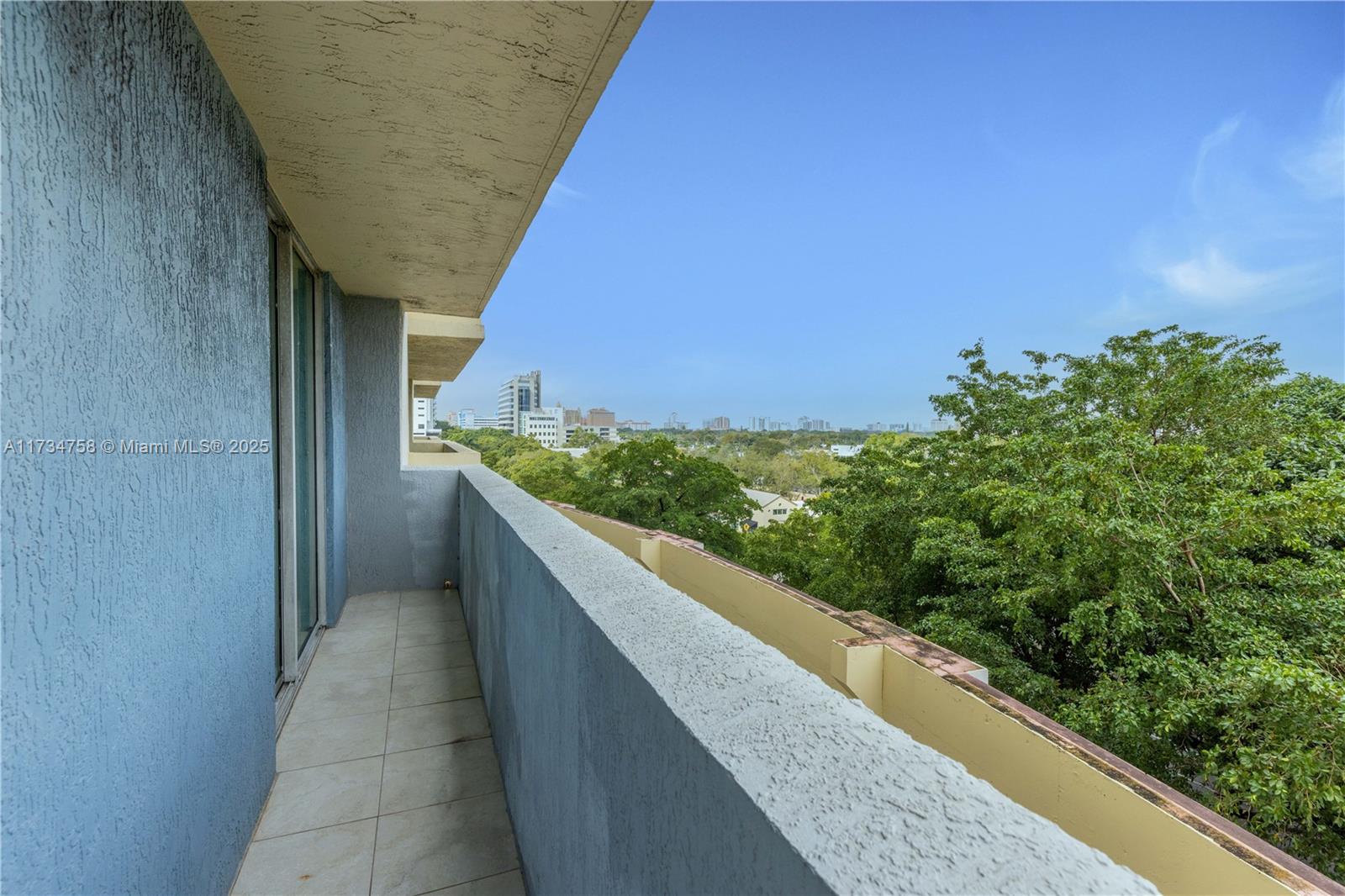3000 Coral Way, Unit 513 Miami, FL 33145 - Photo 19 of 27 a view of balcony with wooden floor