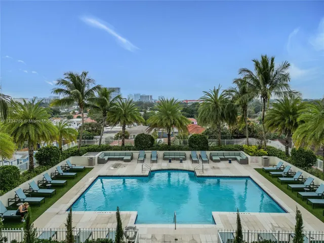 a view of a swimming pool with a lounge chair