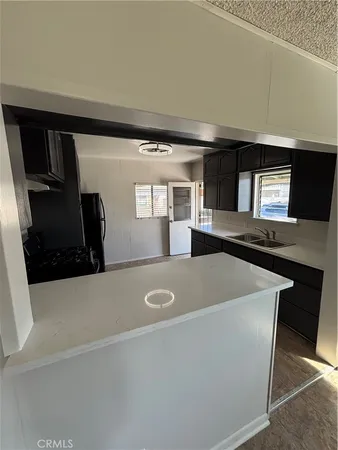 a view of kitchen and front door