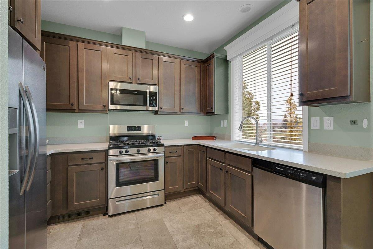 4667 Fruitland Road Marysville, CA 95901 - Photo 2 of 42 a kitchen with stainless steel appliances granite countertop a stove a sink and a microwave
