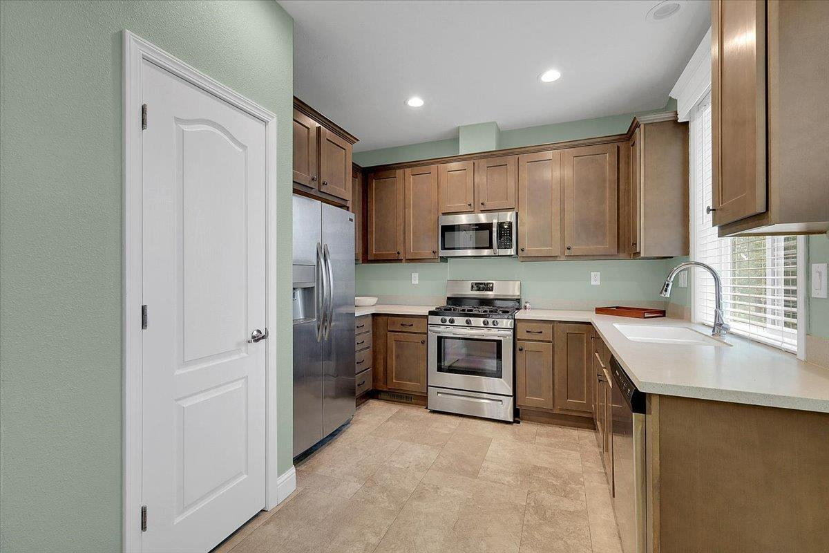 4667 Fruitland Road Marysville, CA 95901 - Photo 7 of 42 a kitchen with stainless steel appliances granite countertop a refrigerator stove and sink