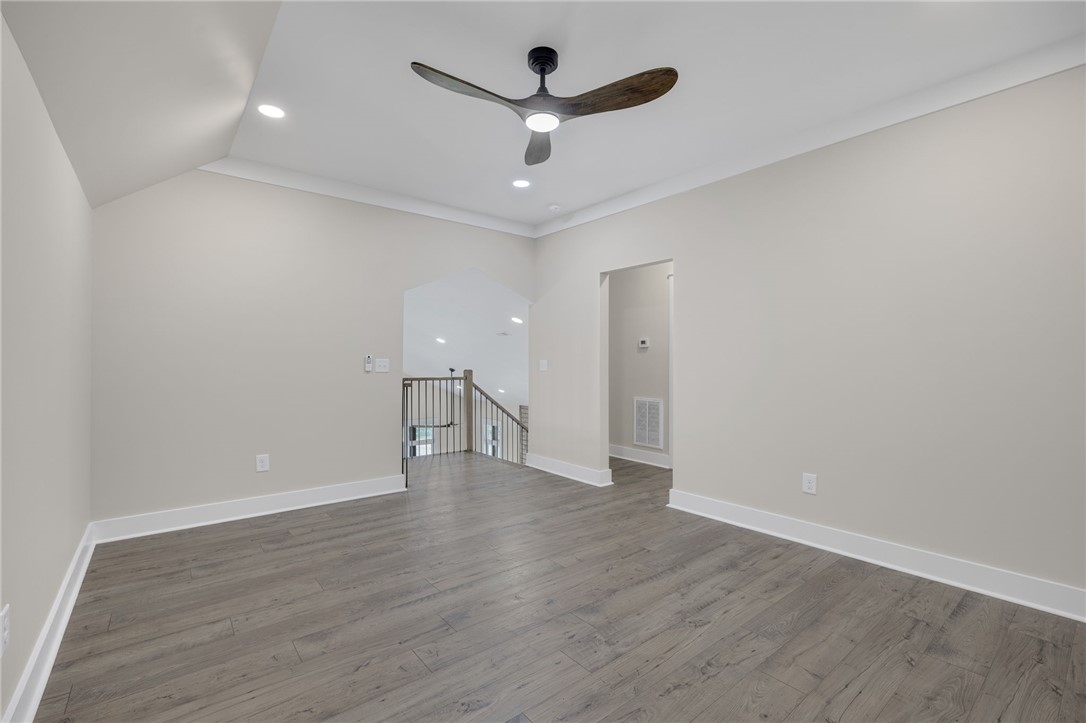 384 Jim Smith Road Pendleton, SC 29670 - Photo 27 of 48 Gleaming hardwood floors and clean crown molding enhance this versatile upper level space.