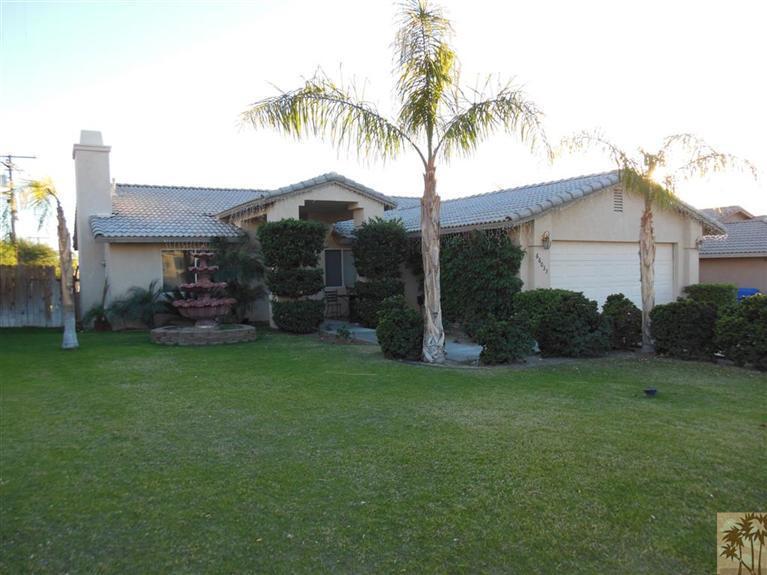 66033 Santa Rosa Road Desert Hot Springs, CA 92240 - Photo 1 of 21 a front view of a house with garden