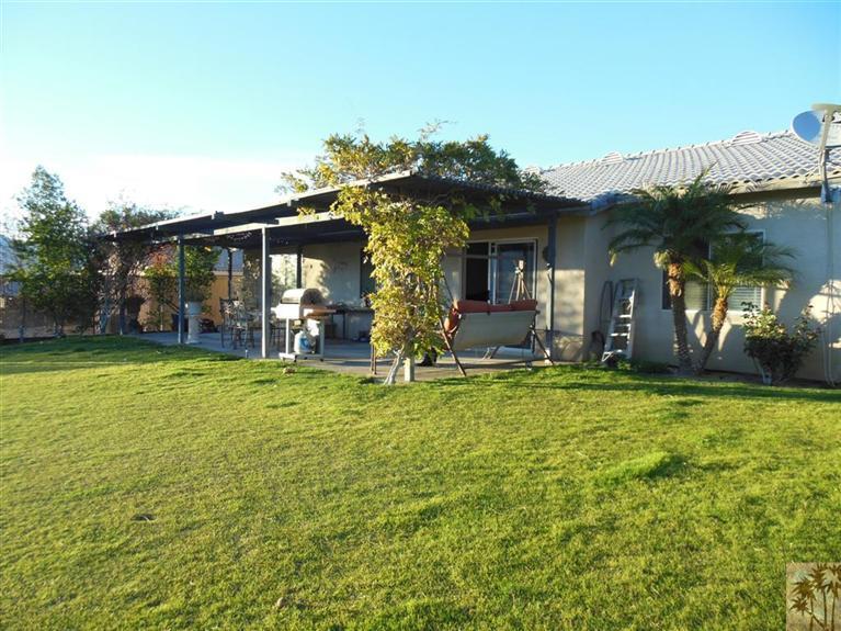 66033 Santa Rosa Road Desert Hot Springs, CA 92240 - Photo 16 of 21 front view of a house with a yard